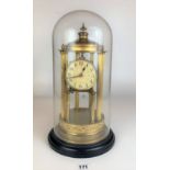 Brass pillared clock under glass dome, 17” high