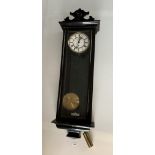 Ebony coloured Vienna wall clock with brass and white face, pendulum and single weight, 32” high