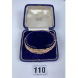 Boxed 9k gold bangle, 8” circumference, w: 9.3 gms