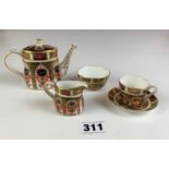 Royal Crown Derby miniature tea set for one - teapot, sugar, cream jug and cup and saucer. Teapot