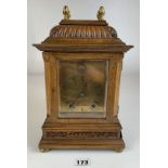 Oak brass faced 2 hole mantle clock with glass sides and with pendulum. 12.5” high x 7.5” wide