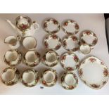 25 piece Royal Albert Country Rose tea service comprising 8 cups (1 small chip on 1 cup), 7 saucers,