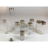 8 assorted silver topped glass bottles and silver thimble, tallest bottle 7” high