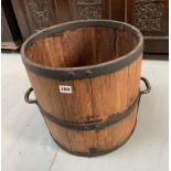 Wooden metal bound barrel with 2 handles. 15” wide x 14.5” high