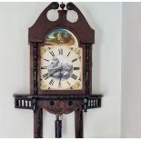 Grandfather clock hood with painted face in wall mounting with pendulum