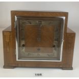 Art deco style square walnut mantle clock with 3 winding holes and pendulum. 10” long x 8.5”.
