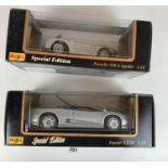 2 boxed Maisto Special Edition 1:18 die cast cars – Jaguar XJ220 and Porsche 550A Spyder
