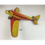 Wind up tin plate airplane, 16” long. Does wind up but In need of restoration