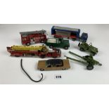 8 assorted Corgi, Dinky and Britains trucks, fire engines, jeeps etc.