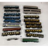 18 assorted Hornby and Kitmaster coaches and 1 flatbed trailer