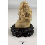 Oriental group ivory figure 4.5” height on wooden base 1.5” height
