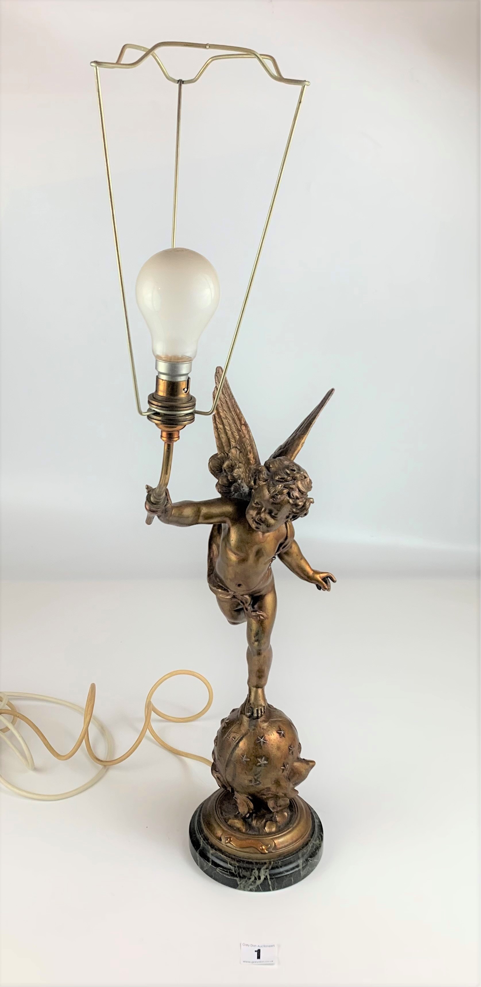 French Spelter cherub lamp on round onyx base with pink lampshade. Marked ‘L’Amour Vagabond’ after