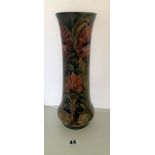 Green Moorcroft Chrysanthemum pattern vase 12” high. Damaged