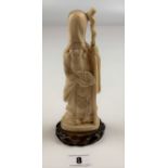 Oriental ivory figure 7” height on wooden base 0.5” high