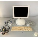 Vintage IMac computer with speakers, keyboard (1 key missing) and mouse