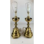 Pair of large ornate brass lamps with 3 studded stones in each and cream and green trim
