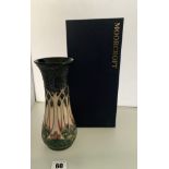 Boxed blue/cream Moorcroft vase 8” high, chips on rim