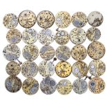 Thirty cylinder fob watch movements with enamel dials