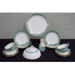 Minton porcelain part tea set; decorated with gilt on turquoise borders, comprising plate 9.25"