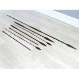Wooden and iron African tribal hunting spear, 70" long; together with six further spearheads, the