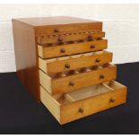 Mahogany six drawer graduated collector's chest, each drawer with a divided interior, 16.75" wide,