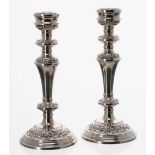 Pair of silver candlesticks, with scrolling repousse decoration, maker W I Broadway & Co. Birmingham
