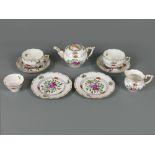 Herend porcelain tea for two, decorated with sprays of flowers within foliate borders, heightened in