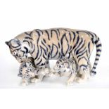 Royal Copenhagen - Tiger with two cubs, a porcelain figural group of, factory stamp and inscribed