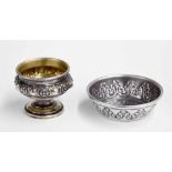 Two .800 Continental silver salts; the first with repousse banded decoration, 2.5" diameter, the