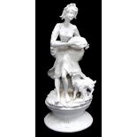 Large blanc de chine style white glazed porcelain figure of a Shepherdess with basket of fruit, a