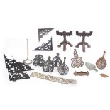 Five Arts & Crafts cast iron pierced shelf brackets, together with an A. Kenrick & Sons No. 8 cast