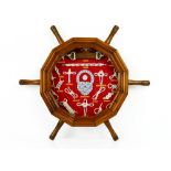 Dodecagon shape glazed wooden case in the form of a ship's wheel containing twenty-one different