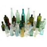 Two boxes containing a large collection of antique and vintage clear and coloured glass bottles,