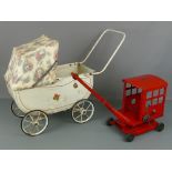 Tri-ang toy crane, approx 20" x 11"; together with a Tri-ang doll's pram, approx 26" x 18" (2)