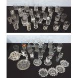 Collection of primarily commemorative glass tumblers, ash trays, etched glass etc.