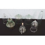 Pair of glass cloches, 8" high; together with a pair of taller cloches with holes 9.5" high, slender