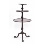 Georgian style mahogany three tier circular dumb waiter, each moulded tier raised on reeded carved