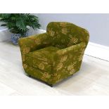 Late 19th century green upholstered child's armchair, on original castors, 20" x high, 23" wide
