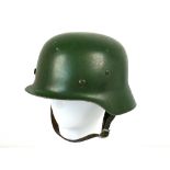WWII German helmet , with original liner stamped Litmannstaddt and chin strap marked R. Larsen,