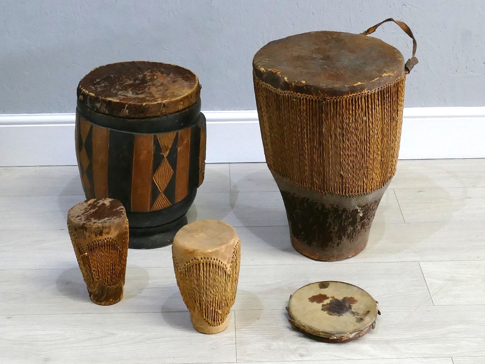 Collection of African native drums including two large floor drums, largest 20" tall, 15"