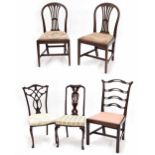 Pair of Heppelwhite style mahogany dining chairs, with carved fluted spindle splats over floral