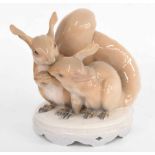 Royal Copenhagen - Two squirrels, a porcelain figural group, factory stamp, inscribed numbered 416