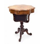 Victorian burr walnut sewing table, the wavy top over a single drawer and sliding sewing basket,