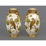 Pair of Royal Bonn porcelain vases, with baluster shaped body, applied with ribbon bow handles and