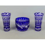 Pair of Bohemian heavy cobalt blue cut to clear glass faceted flower vases, 7" tall; together with a