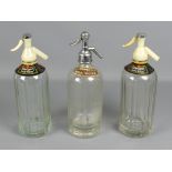 Two similar vintage etched glass Shweppes soda syphons; together with a J Hayward of Salisbury