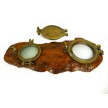 Two heavy brass ship's portholes affixed to a piece of polished driftwood, approx 34" x 15" (one