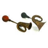 Brass automobile trumpet horn with rubber bulb (working); together with a similar brass horn (