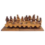 Continental carved wooden parquetry figural group of 'The Last Supper', 20" wide, 6.5" high approx