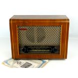 1950s PYE model P75 walnut veneered cased radio, with original guarantee and instruction papers, 16"